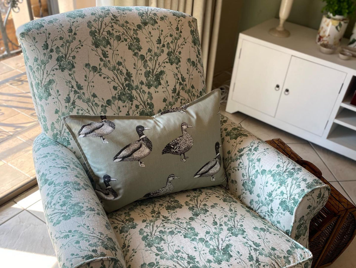 Arm chair and pillow with ducks motiv