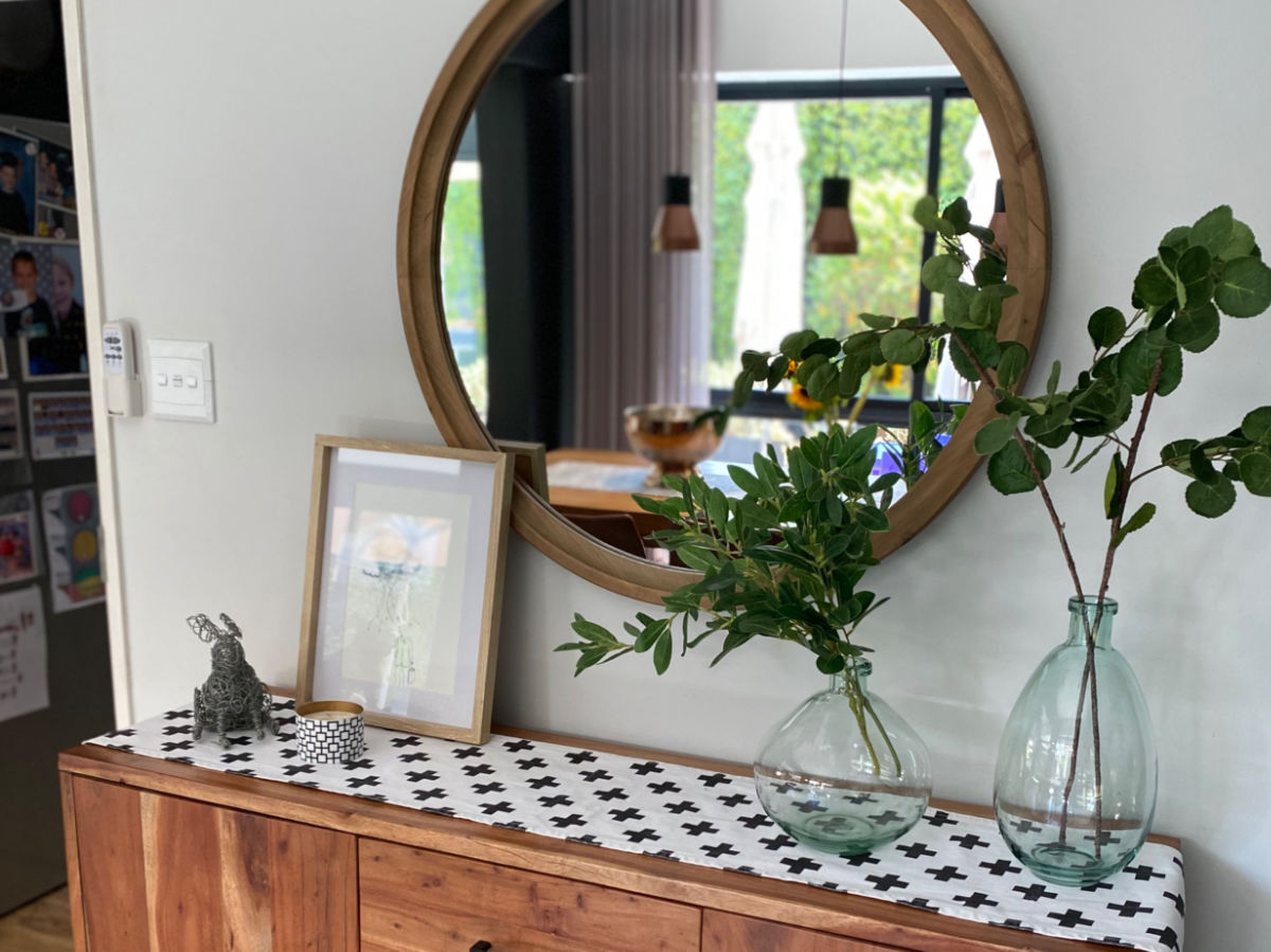 Oval mirror and plants