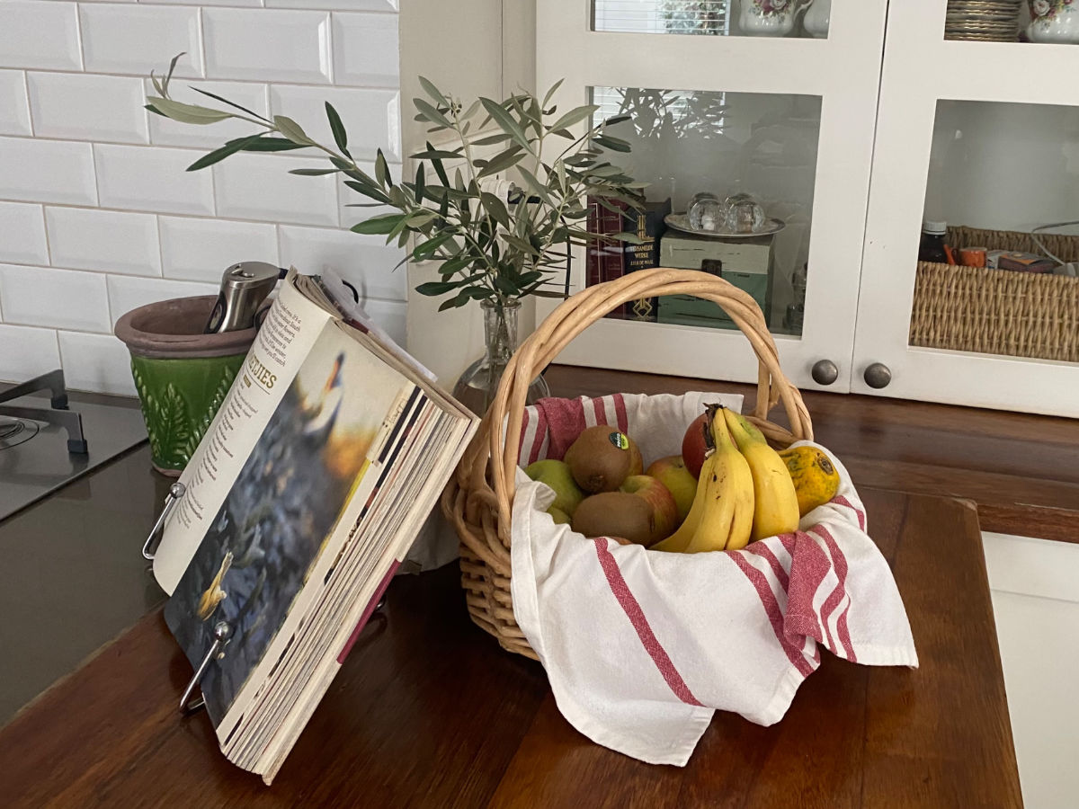 Fruit basket and olive leaves